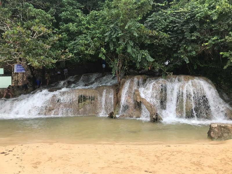 Lower section of Dunn’s River Falls where the waterfall meets the beach in Jamaica.