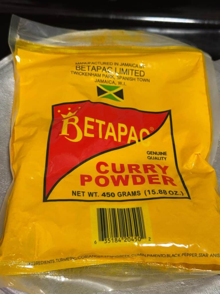Bag of Betapac Jamaican curry powder, the authentic brand used in curry goat and curry chicken