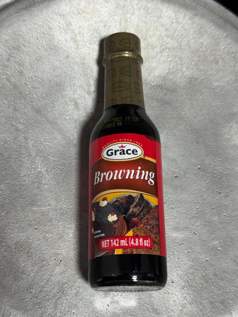 Bottle of Grace browning sauce used to color and flavor Jamaican stew chicken and oxtail