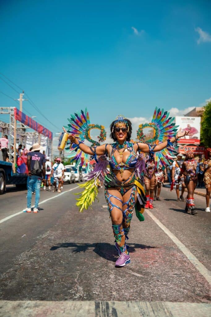 Masquerader in feathered costume at Jamaica Carnival — a highlight for anyone planning the best time to visit Jamaica around festival season.